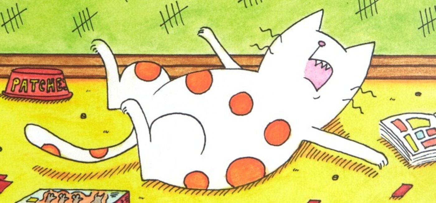 Mr Patches, a white cat with orange spots, sprawled dramatically on the floor beside his food bowl.
